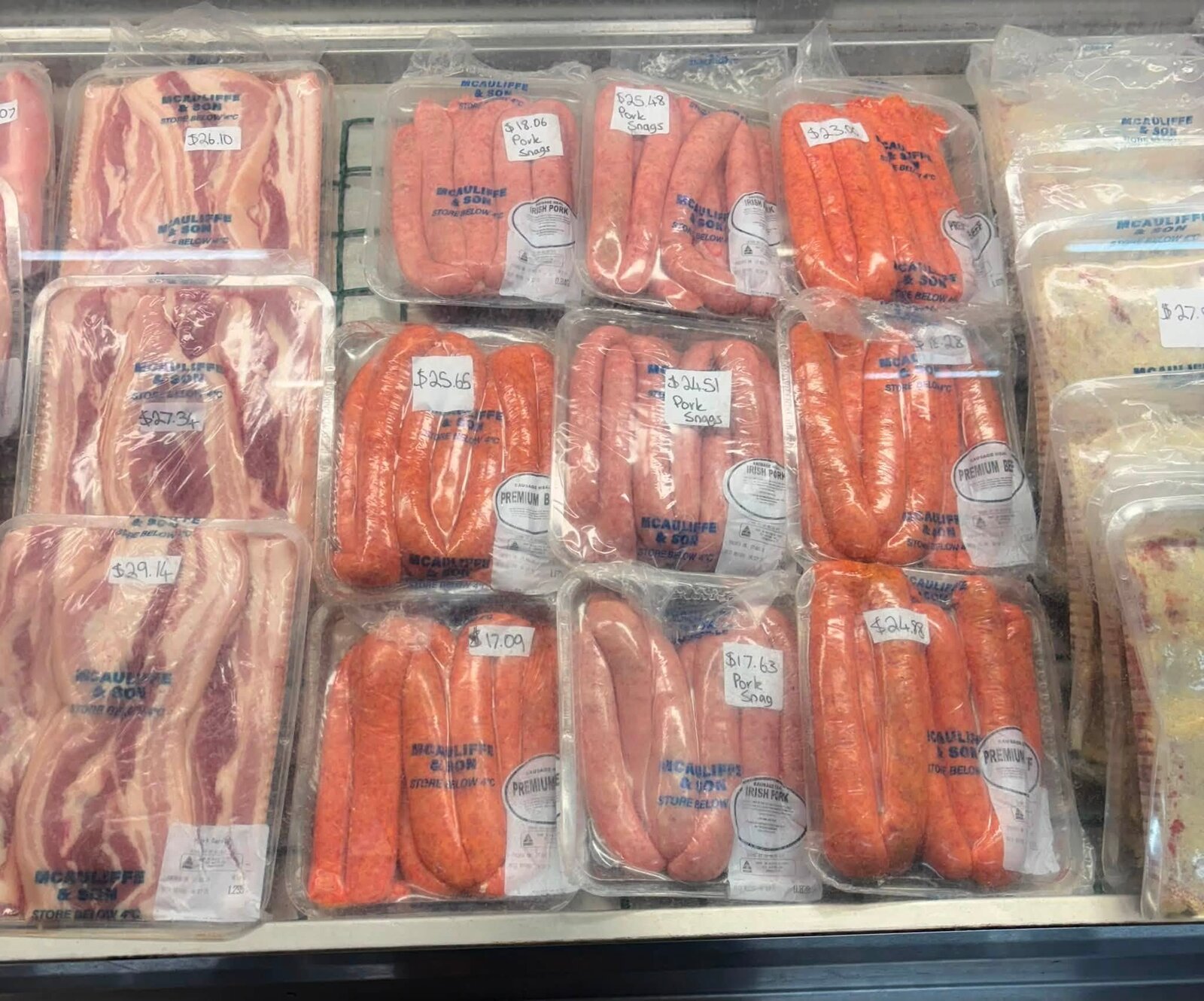 McAuliffe and Son meat display case at Giru Convenience featuring sausages, bacon and smallgoods