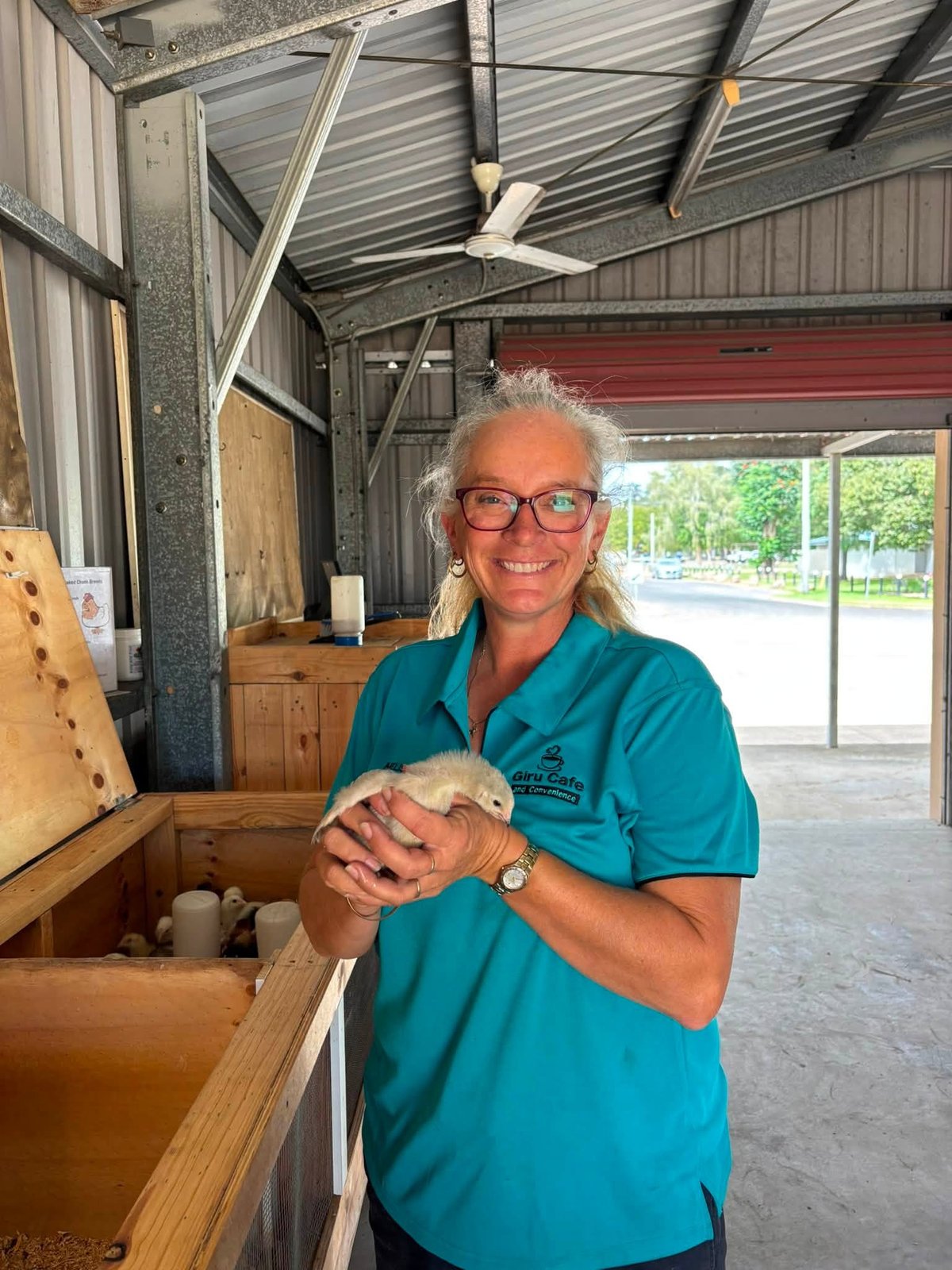 Melissa caring for baby chickens at Giru Feed & Farm Supplies